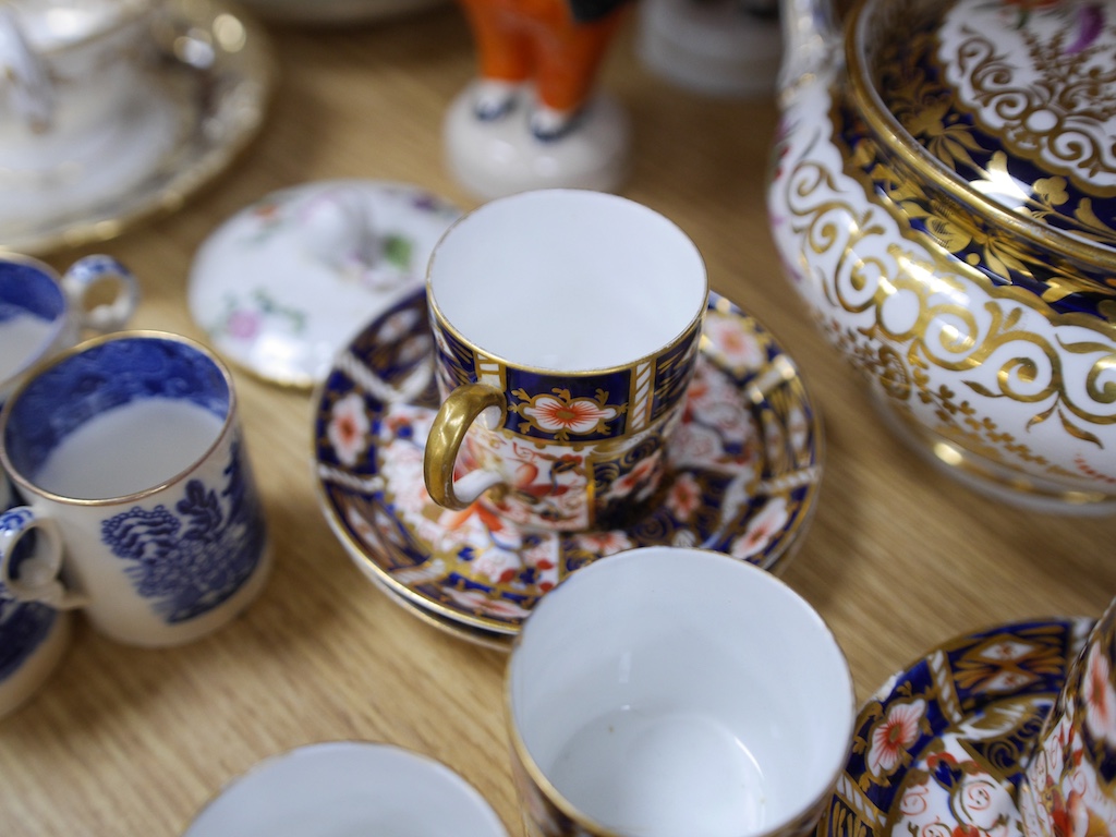 An English part teaset, c.1825 and six Royal Crown Derby coffee cans and saucers etc. Condition - some items cracked chipped and losses to gilding, teapot cover finial broken